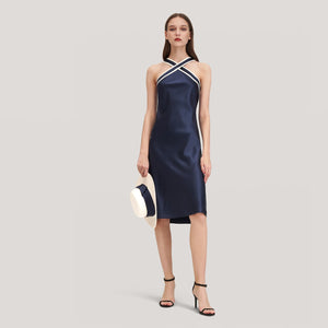Lily's Navy Blue Silk Dress is sure to have heads turning! Crafted from luxurious, lightweight silk, this halter-neck dress is the perfect choice for a special event. Its classic design and stylish cut provide an elegant, timeless look while its airy fabric keeps you feeling comfortable all night. Make a lasting impression with Lily's Navy Blue Silk Dress.