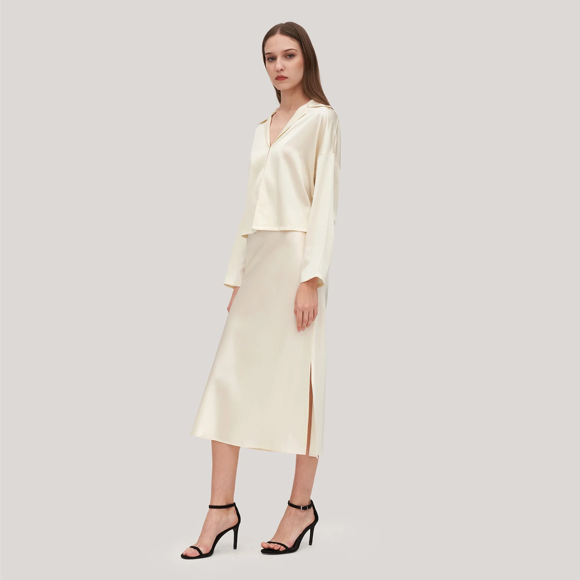 The Ensemble Adeline is the ultimate ladies essential, featuring a minimalist aesthetic with a silk poppy skirt, side slit bottom and femme fit. Perfect for your wardrobe, this ensemble is sure to give your wardrobe an upgrade.