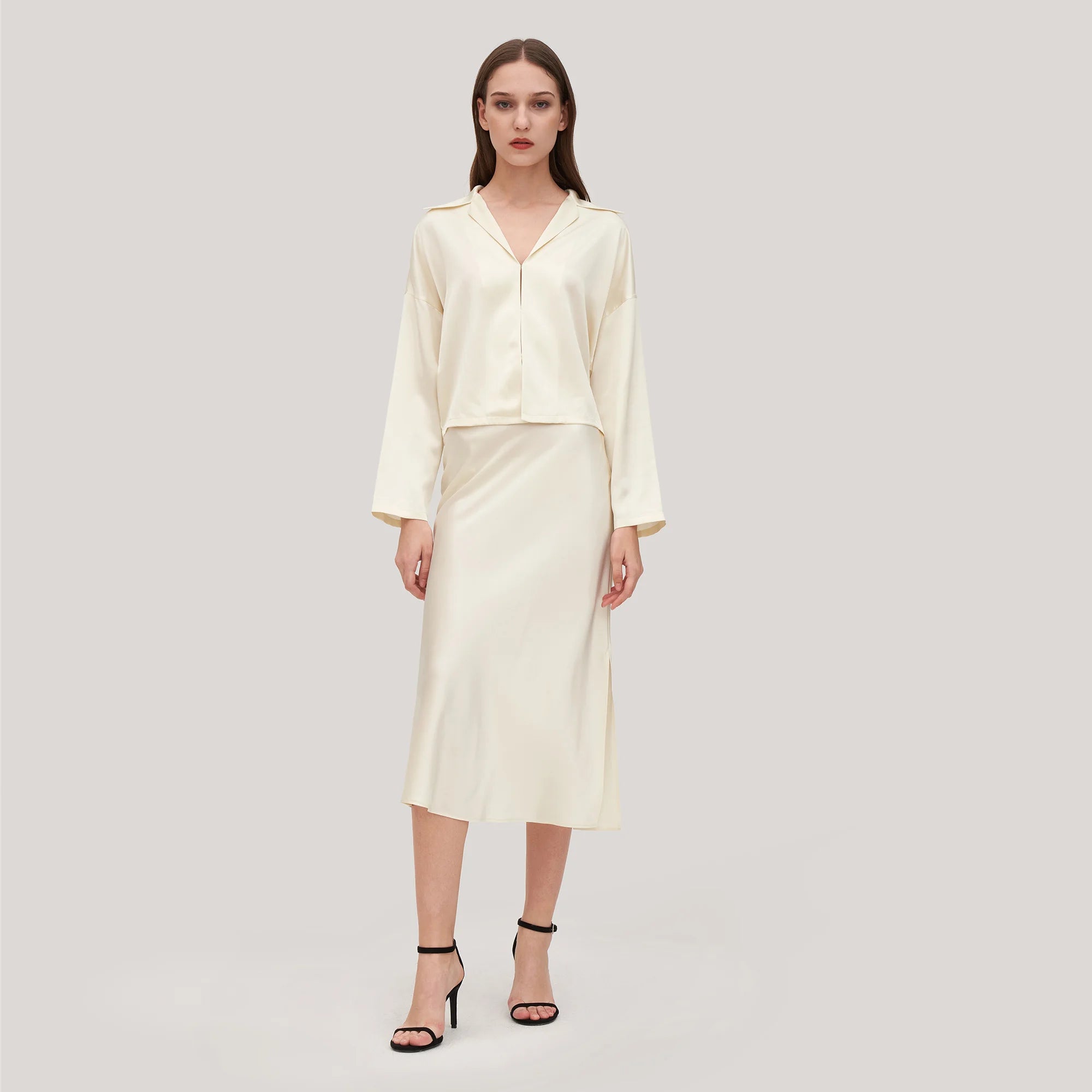 The Ensemble Adeline is the ultimate ladies essential, featuring a minimalist aesthetic with a silk poppy skirt, side slit bottom and femme fit. Perfect for your wardrobe, this ensemble is sure to give your wardrobe an upgrade.